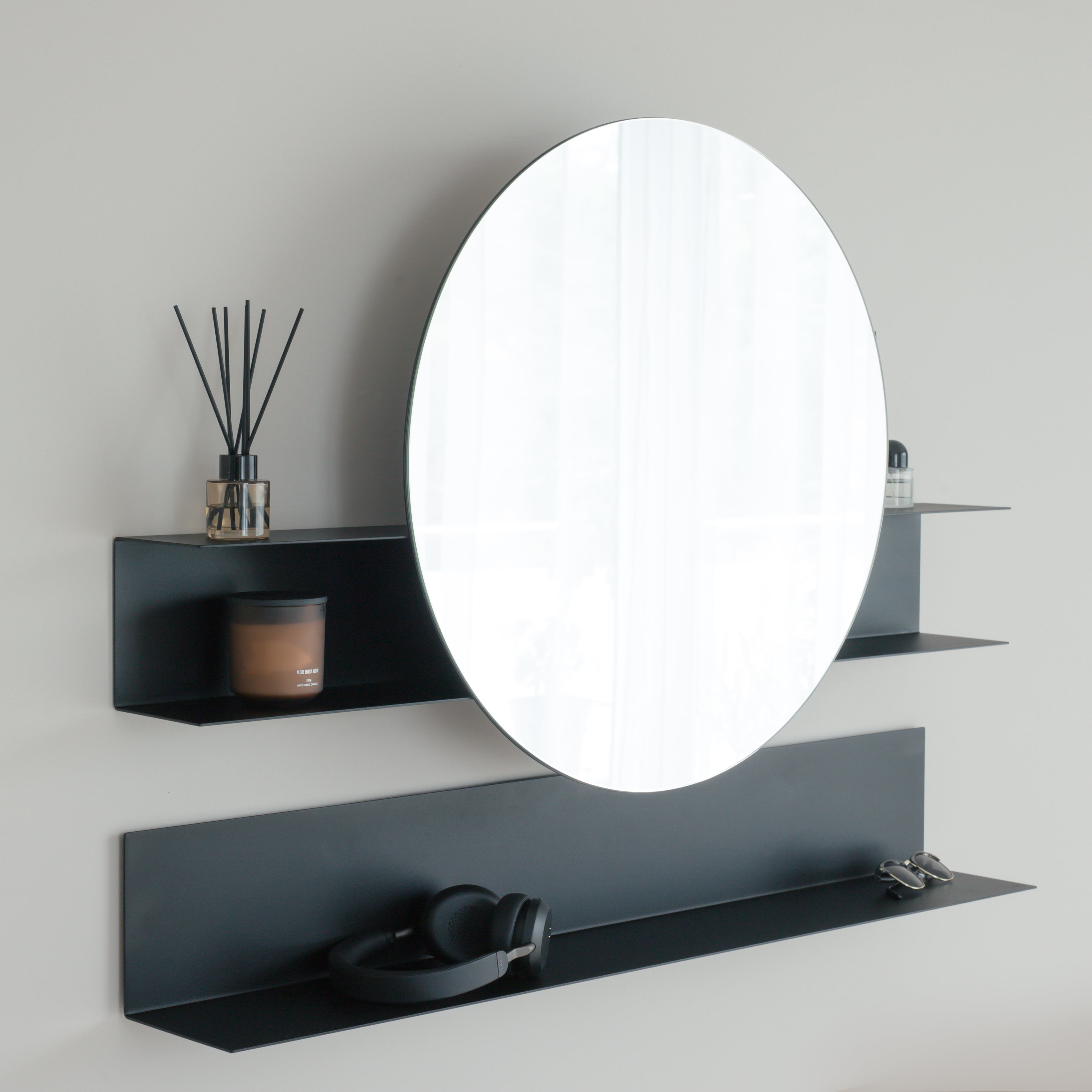 Black round wall mirror with modern shelf for hallway