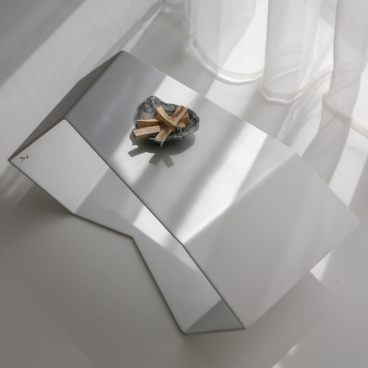 Modern RAW finish table captured from a high diagonal perspective