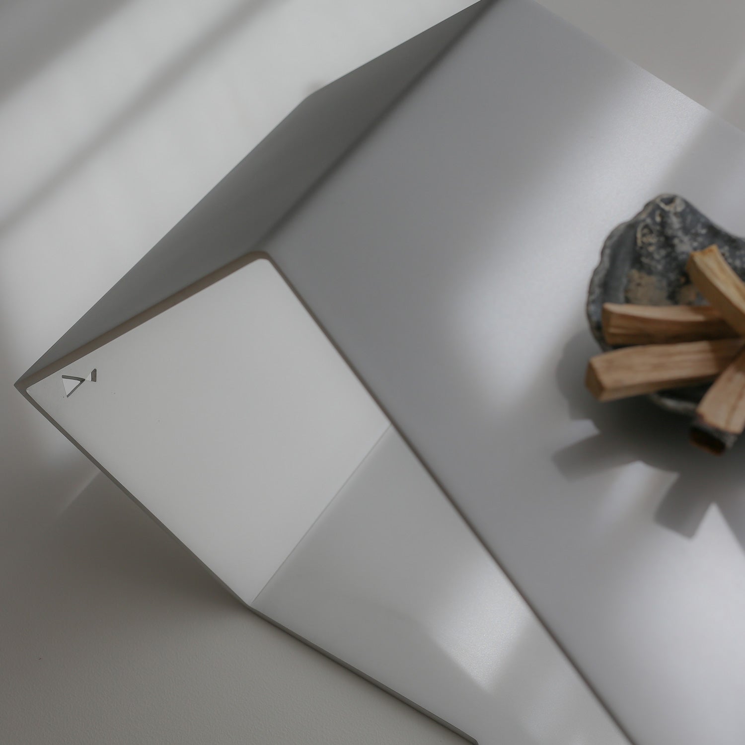 Detail view of RAW finish table top with Steelve logo cutout