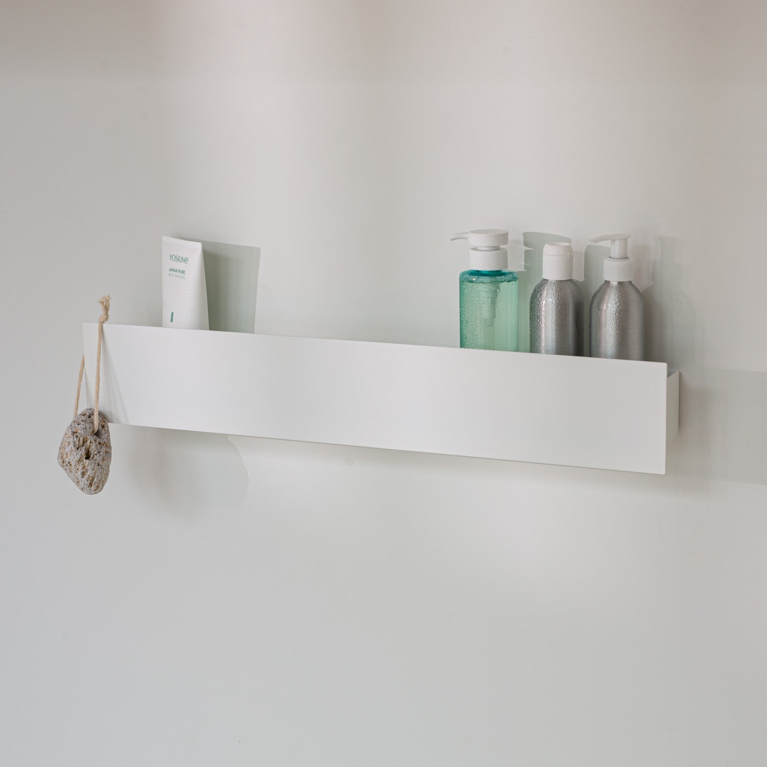 White modern wall-mounted shower shelf without drilling, sleek and durable design